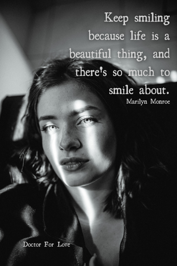 a monochrome image of a woman with the window reflecting light on her face