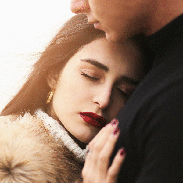 woman-being-hugged-by-a-man