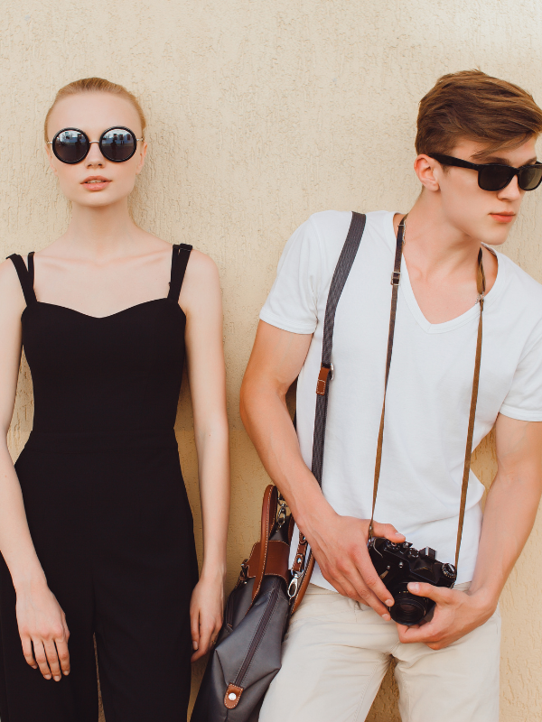 couple-posing-next-to-a-wall