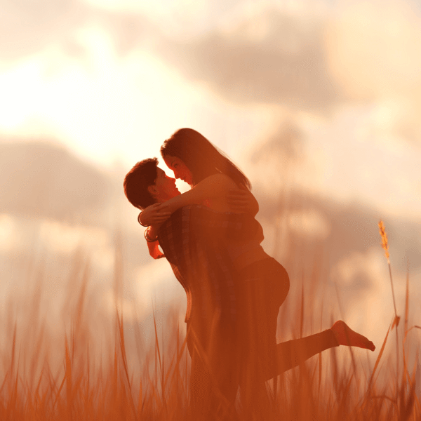 two-lovers-hugging-on-a-field