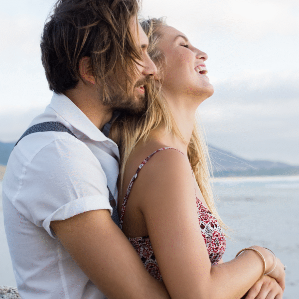 couple-smiling-looking-at-the-sea