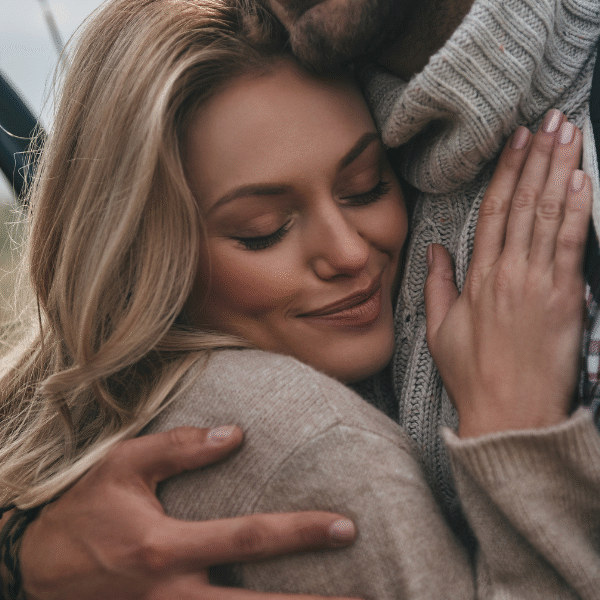 woman-being-hugged-by-her-man