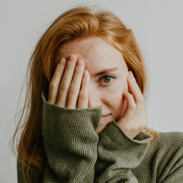 woman-portrait-with-a-hand-in-front-of-her-eyes