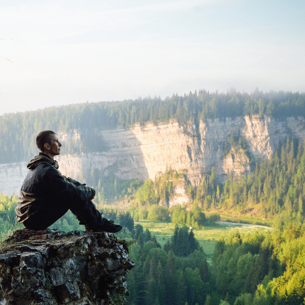 man-standing-on-a-rock