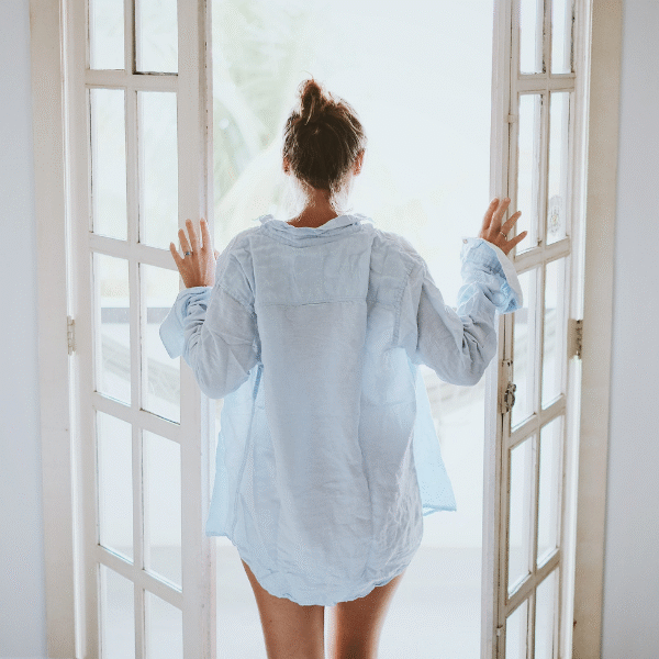 woman-opening-the-windows-in-the-morning
