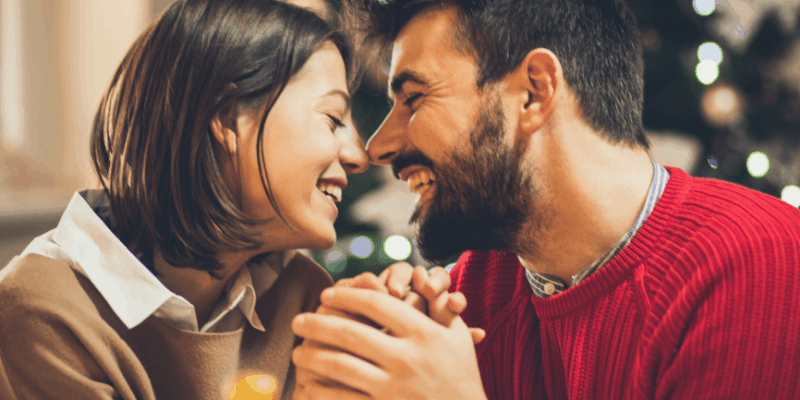 couple-holding-hands-and-smiling-at-each-other