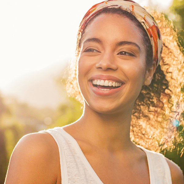 woman-smiling-in-the-sunrays