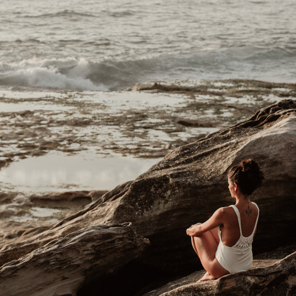 woman-meditating-on-a-rock