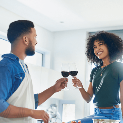 couple-having-a-glass-of-wine-in-the-kitchen