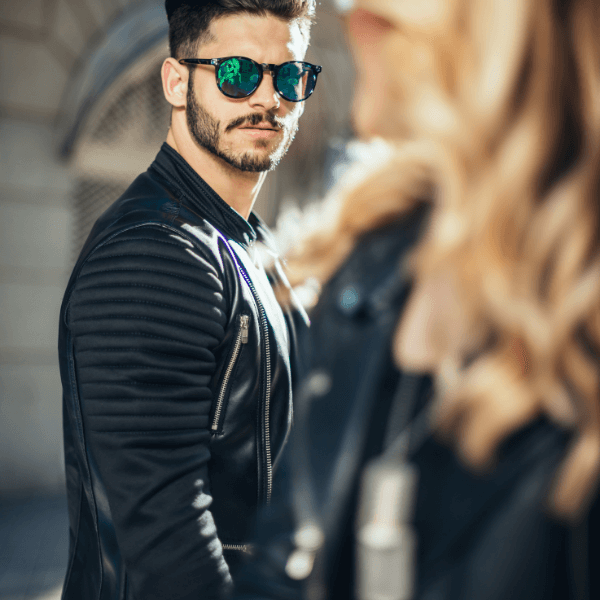man-wearing-sunglasses-looking-after-a-girl