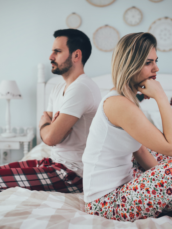photo of a couple with their back towards each other facing the most common relationship problems