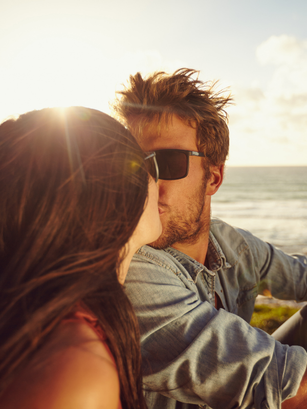 couple kissing on the beach