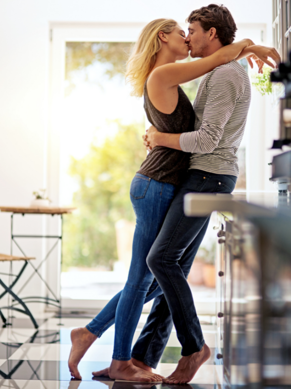couple kissing on the counter