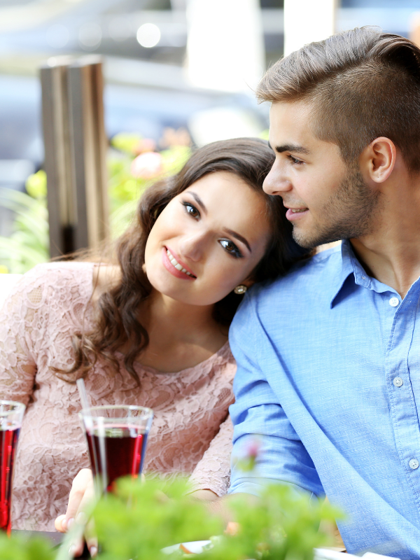 woman leaning her head on mans shoulder