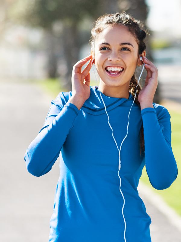 woman with headphones smiling