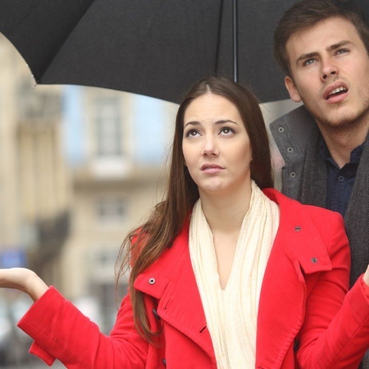 couple looking at a cloudy rainy sky featured photo