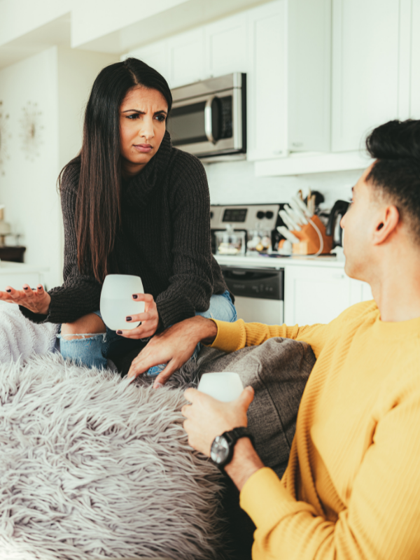 woman frowning at a man