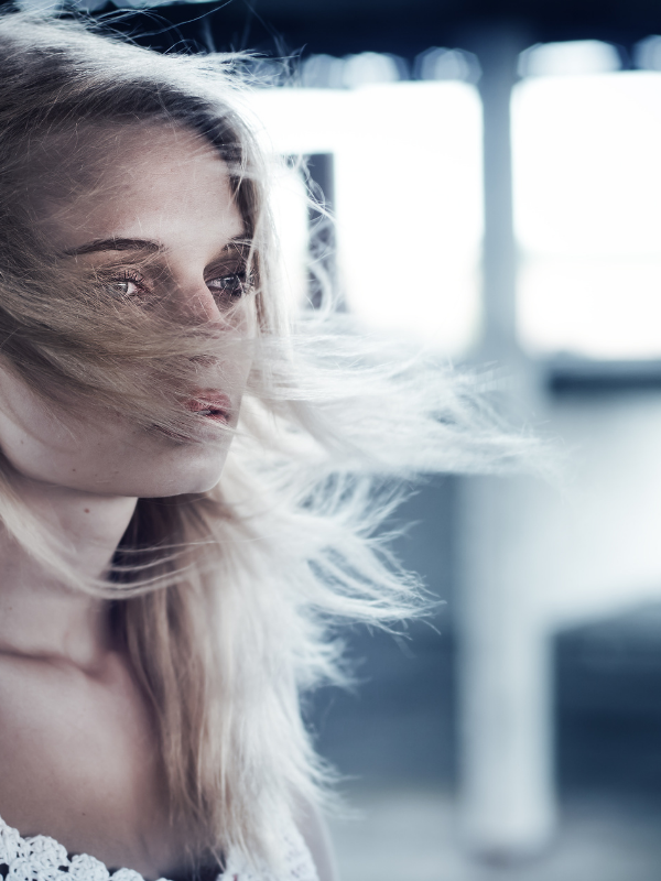 woman with blond hair looking ahead